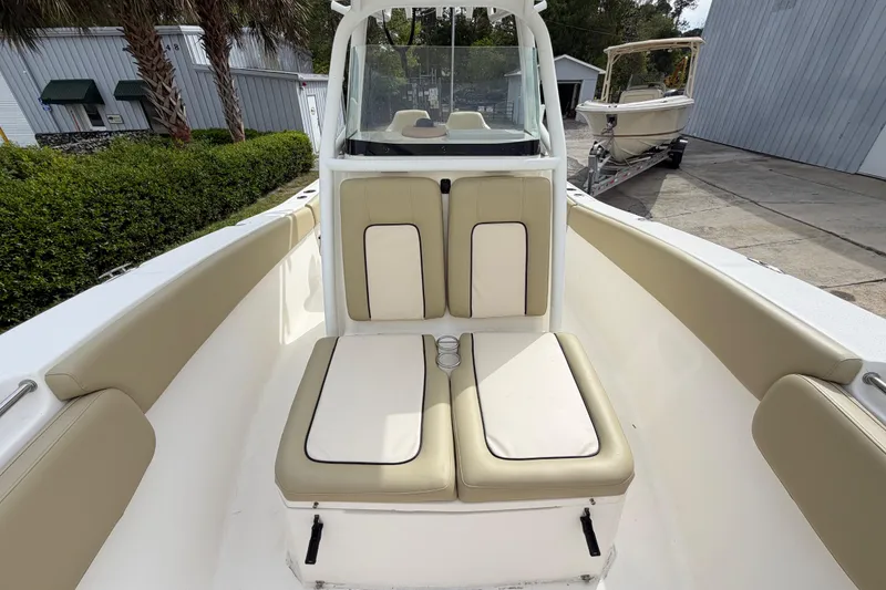 Slide: The Image of 2015 Sea Fox 266 Commander boat interior with beige seating and console. - 36