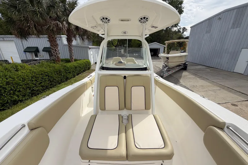Slide: The Image of 2015 Sea Fox 266 Commander boat interior with beige seating and center console. - 37