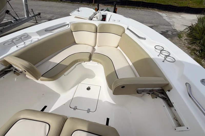 Slide: The Image of 2015 Sea Fox 266 Commander boat interior with beige seating and cup holders. - 38