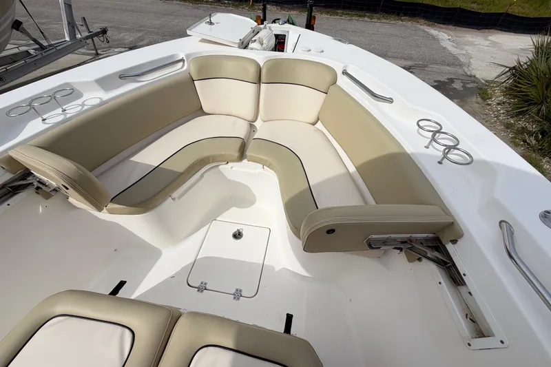 Slide: The Image of 2015 Sea Fox 266 Commander boat interior with beige seating and cup holders. - 39