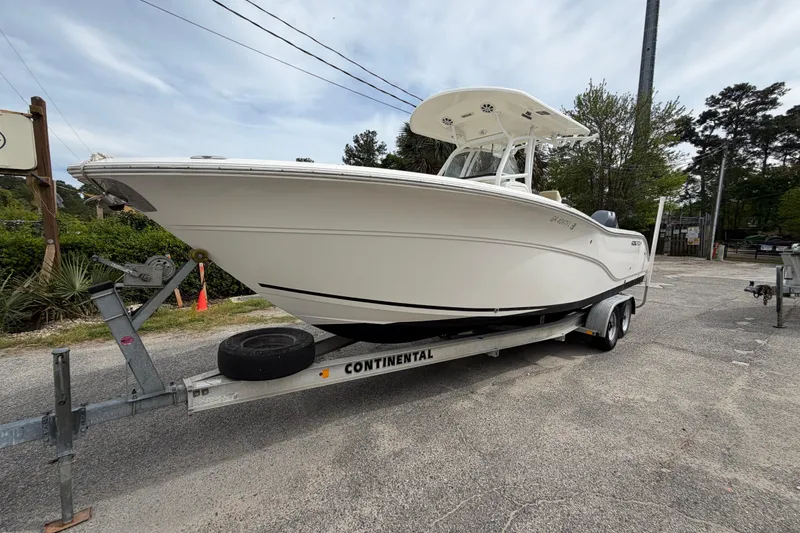 Slide: The Image of 2015 Sea Fox 266 Commander boat on trailer, parked outdoors. - 4
