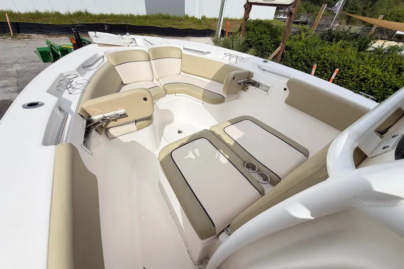 Slide: The Image of 2015 Sea Fox 266 Commander boat interior with beige seating and cup holders. - 44