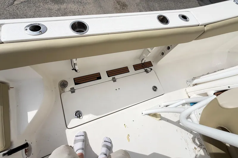 Slide: The Image of 2015 Sea Fox 266 Commander boat interior with rod holders and seating. - 46