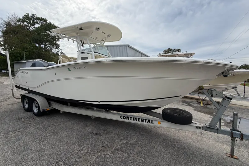 Slide: The Image of 2015 Sea Fox 266 Commander boat on trailer, parked outdoors. - 5