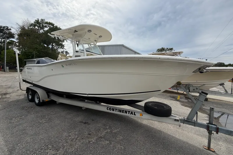 Slide: The Image of 2015 Sea Fox 266 Commander boat on trailer, parked outdoors. - 6