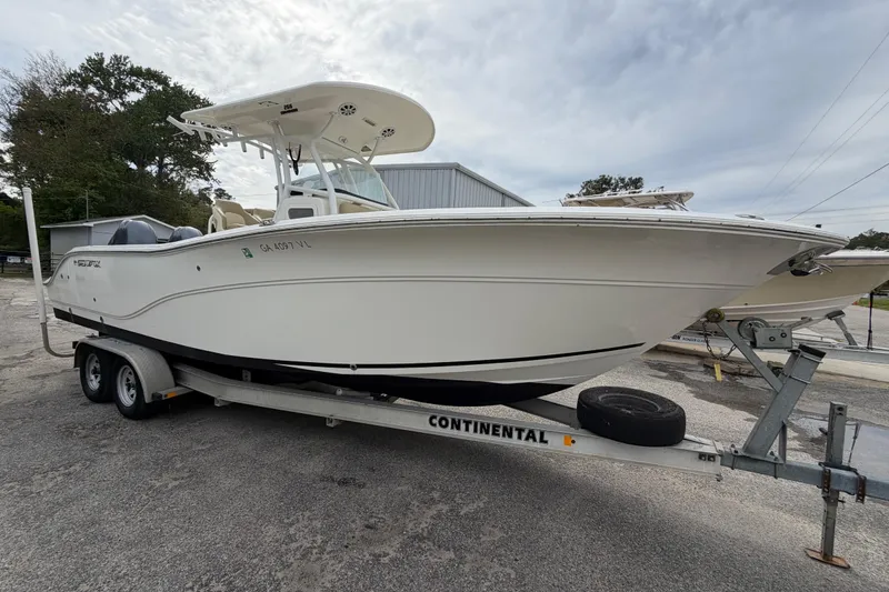 Slide: The Image of 2015 Sea Fox 266 Commander boat on trailer, parked outdoors. - 8