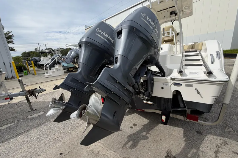 Slide: The Image of 2015 Sea Fox 266 Commander with dual Yamaha outboard engines, parked outdoors. - 9