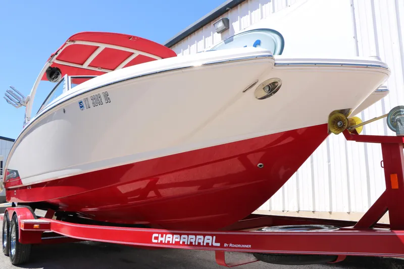Slide: The Image of 2014 Chaparral 244 Xtreme boat on red trailer, side view. - 13