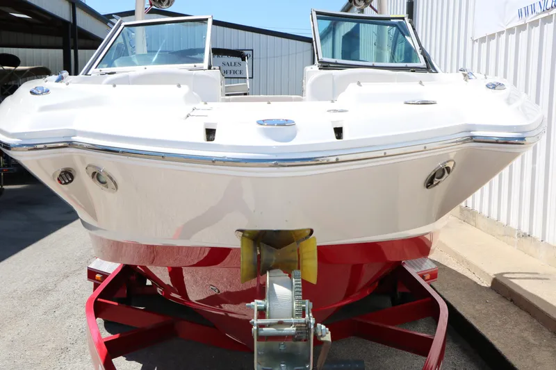 Slide: The Image of 2014 Chaparral 244 Xtreme boat on red trailer, front view. - 16