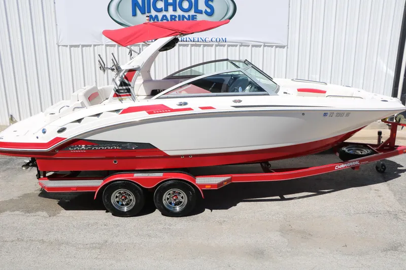 Slide: The Image of 2014 Chaparral 244 Xtreme boat with red accents on a matching trailer. - 17