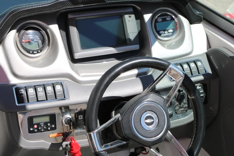Slide: The Image of Dashboard of a 2014 Chaparral 244 Xtreme boat with steering wheel and controls. - 31
