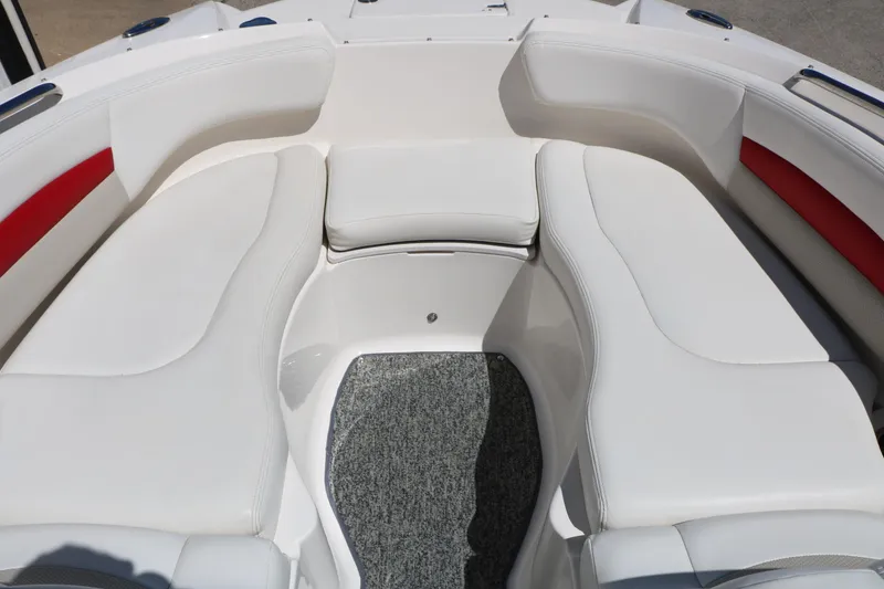Slide: The Image of 2014 Chaparral 244 Xtreme boat interior with white seating and red accents. - 33