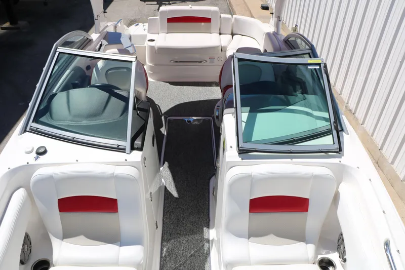 Slide: The Image of 2014 Chaparral 244 Xtreme boat interior with white and red seating, open windshield. - 34