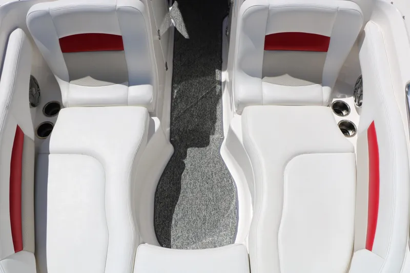 Slide: The Image of 2014 Chaparral 244 Xtreme boat interior with white and red seating, cup holders. - 36