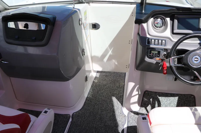 Slide: The Image of 2014 Chaparral 244 Xtreme boat interior with steering wheel and control panel. - 38