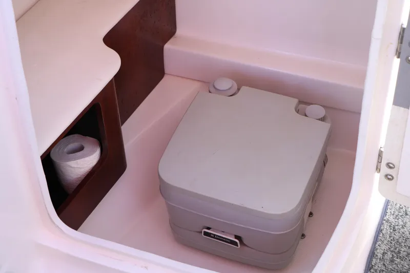 Slide: The Image of Portable toilet in 2014 Chaparral 244 Xtreme boat cabin with toilet paper storage. - 40