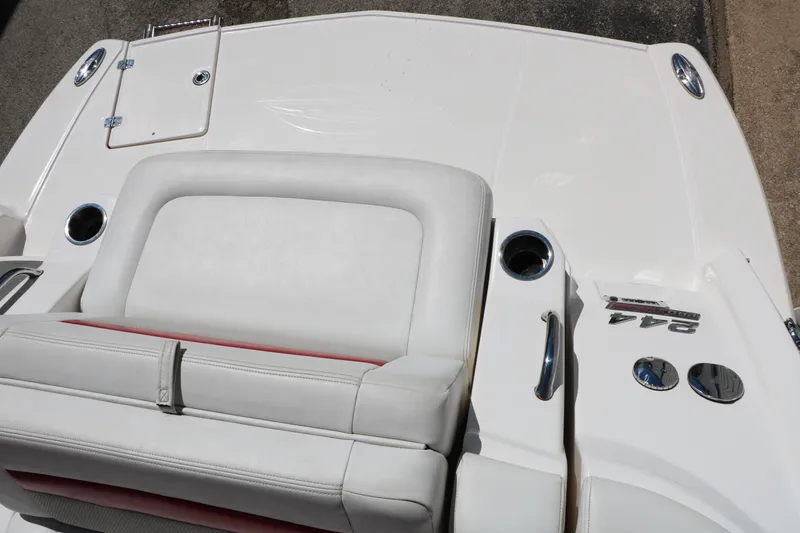 Slide: The Image of 2014 Chaparral 244 Xtreme boat deck with white seating and cup holders. - 43