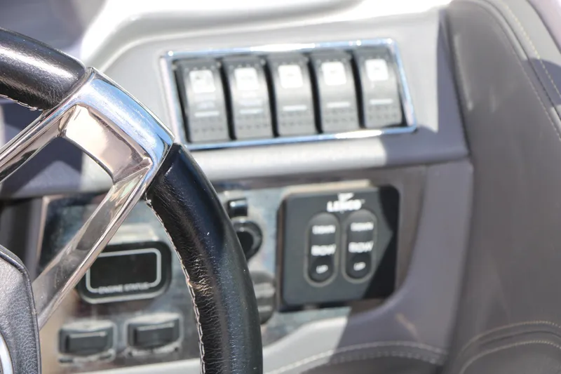 Slide: The Image of Steering wheel and control panel of 2014 Chaparral 244 Xtreme boat. - 47