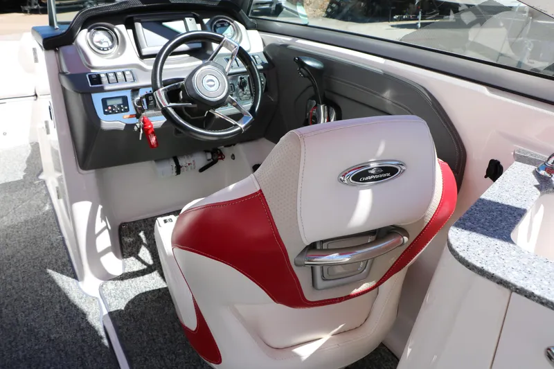 Slide: The Image of 2014 Chaparral 244 Xtreme boat interior with steering wheel and captain's seat. - 51