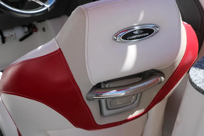 Slide: The Image of Red and white seat of 2014 Chaparral 244 Xtreme boat with logo and handle. - 52