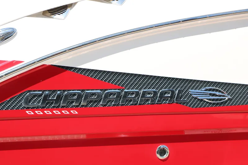 Slide: The Image of 2014 Chaparral 244 Xtreme boat logo on red and carbon fiber background. - 6