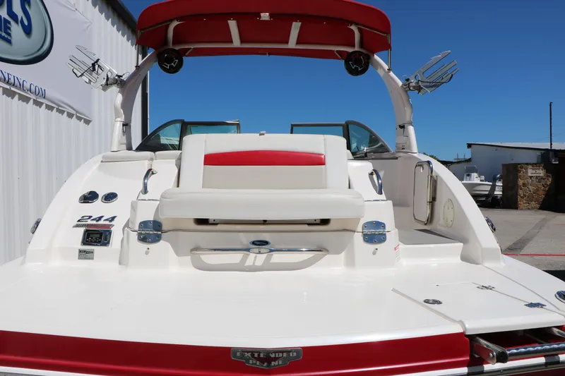 Slide: The Image of 2014 Chaparral 244 Xtreme boat with red and white seating, rear view. - 7