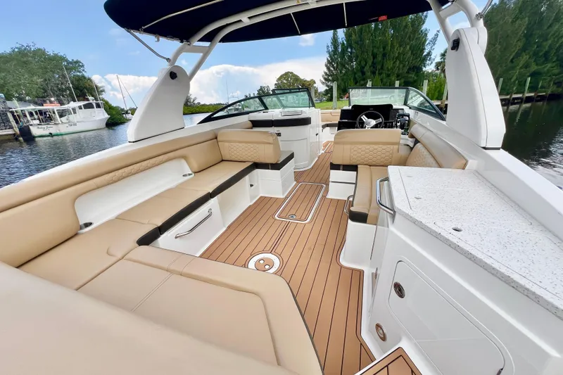 Slide: The Image of 2019 Sea Ray SDX 290 Outboard boat interior with luxurious seating and sleek design. - 11