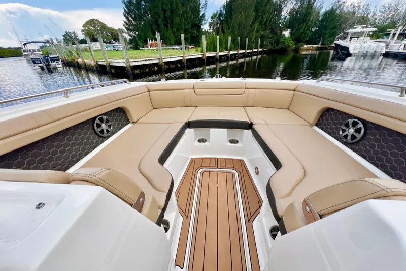 Slide: The Image of 2019 Sea Ray SDX 290 Outboard boat interior with spacious seating and elegant design. - 24