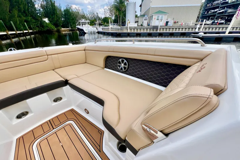Slide: The Image of 2019 Sea Ray SDX 290 Outboard boat with luxurious tan seating and elegant interior design. - 25