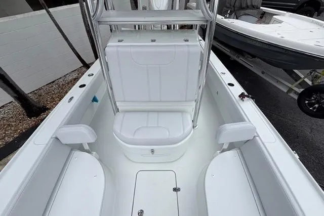 Slide: The Image of 2025 Contender 26 Bay boat interior with seating and storage compartments. - 18