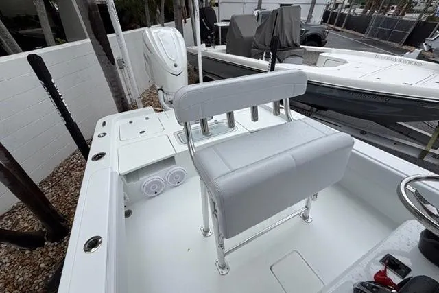 Slide: The Image of 2025 Contender 26 Bay boat interior with seating and motor, showcasing modern design. - 20