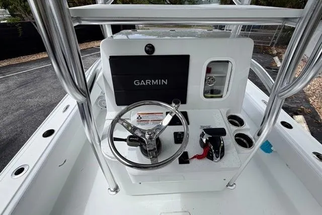 Slide: The Image of 2025 Contender 26 Bay boat console with Garmin navigation system and steering wheel. - 9