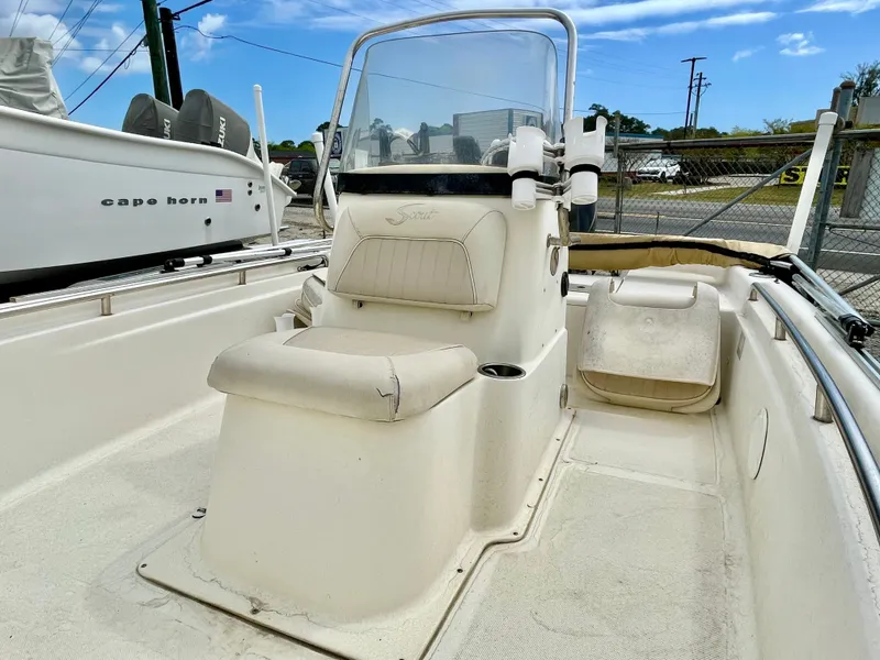 Slide: The Image of 2004 Scout Sportfish 160 boat interior with steering console. - 13