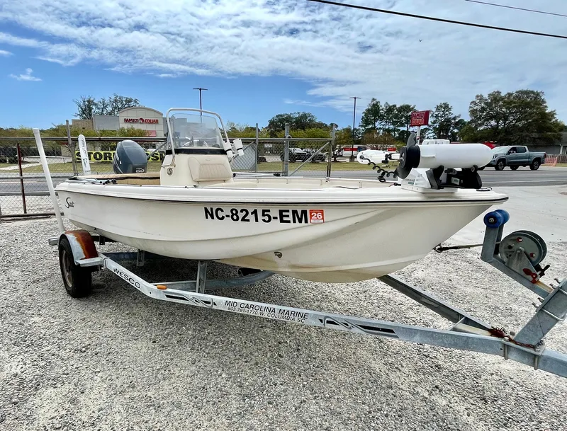 Slide: The Image of 2004 Scout Sportfish 160 boat on trailer, side view. - 15