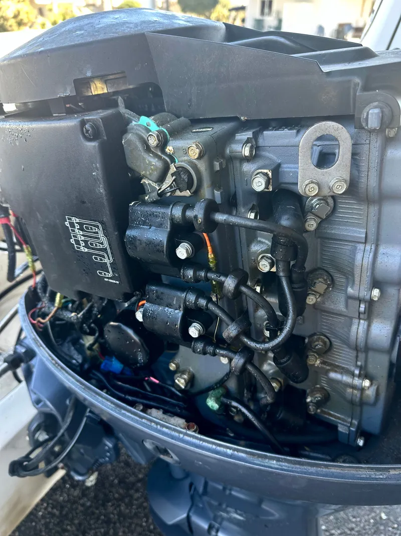 Slide: The Image of Close-up of a 2004 Scout Sportfish 160 outboard motor. - 16