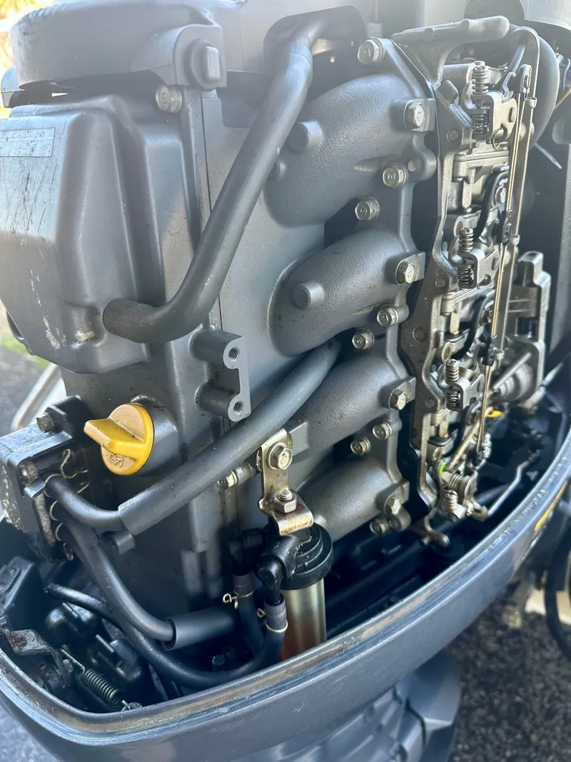 Slide: The Image of Close-up of a 2004 Scout Sportfish 160 outboard motor. - 17