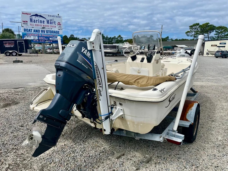 Slide: The Image of 2004 Scout Sportfish 160 boat with Yamaha engine on trailer. - 4