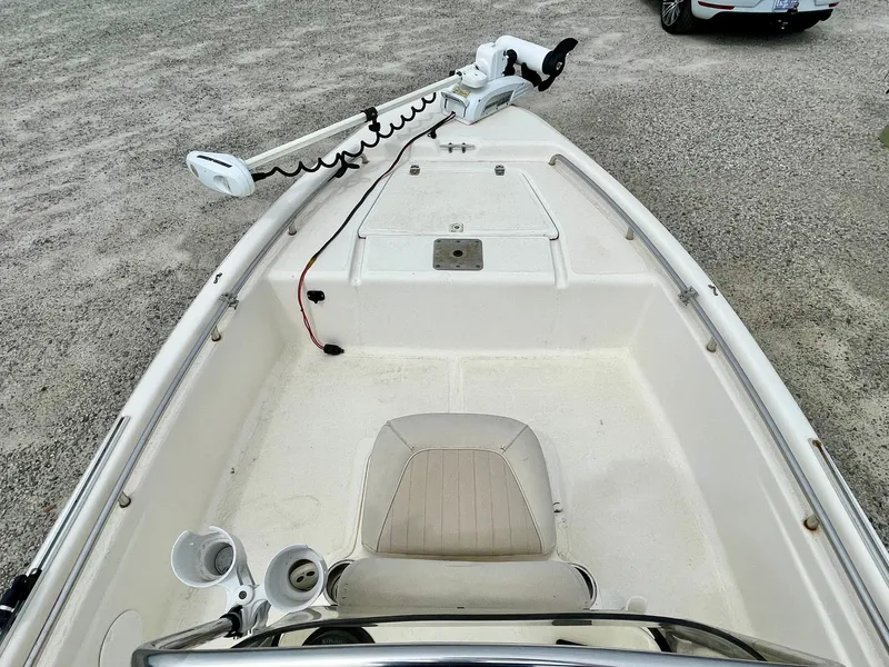 Slide: The Image of 2004 Scout Sportfish 160 boat with steering console and seat. - 9