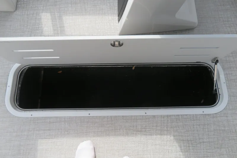 Slide: The Image of Open storage compartment in Avalon Venture 85 Rear Fish 2026 boat. - 18