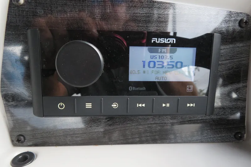 Slide: The Image of Fusion radio on Avalon Venture 85, displaying FM 103.5. - 36