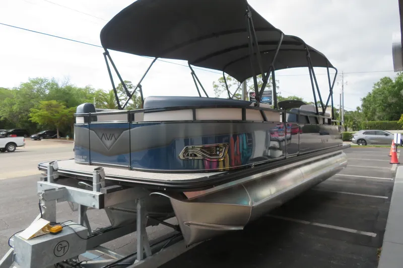 Slide: The Image of 2026 Avalon Venture 85 Rear Fish pontoon boat on trailer. - 4