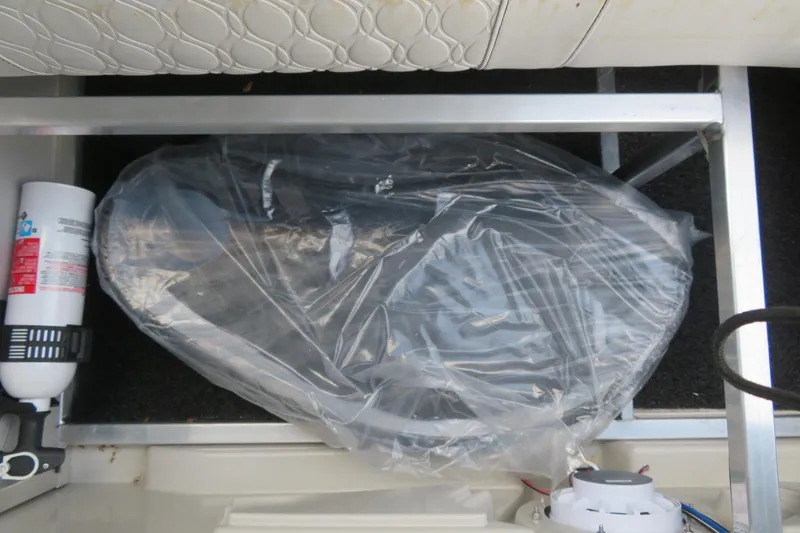 Slide: The Image of Interior of Avalon Venture 85 Rear Fish 2026 with fire extinguisher and packaged accessory. - 42