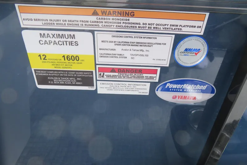 Slide: The Image of Warning and capacity labels on Avalon Venture 85 boat. - 45