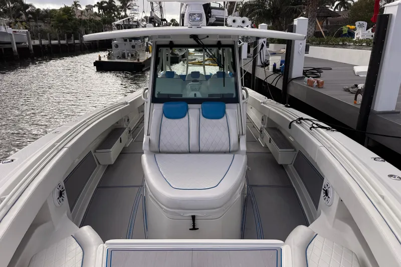 Slide: The Image of 2016 Hydra-Sports 4200 Siesta boat with luxurious seating and sleek design docked by the water. - 10