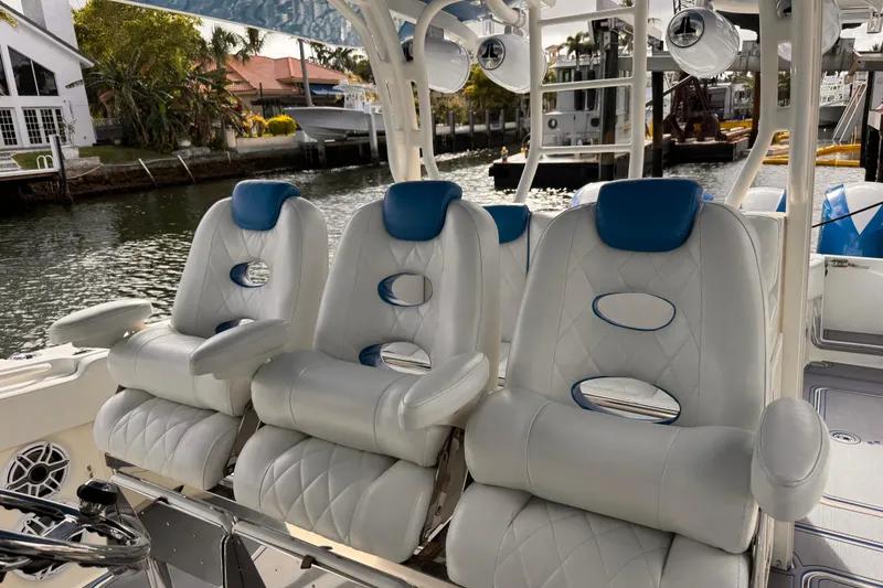 Slide: The Image of Luxurious seating on a 2016 Hydra-Sports 4200 Siesta boat, docked by a waterfront. - 13