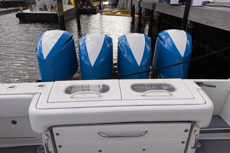 Slide: The Image of 2016 Hydra-Sports 4200 Siesta boat with four blue and white outboard engines. - 16