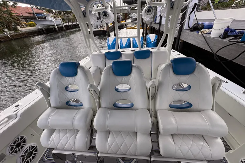 Slide: The Image of Luxury seating on a 2016 Hydra-Sports 4200 Siesta boat, docked by the water. - 19