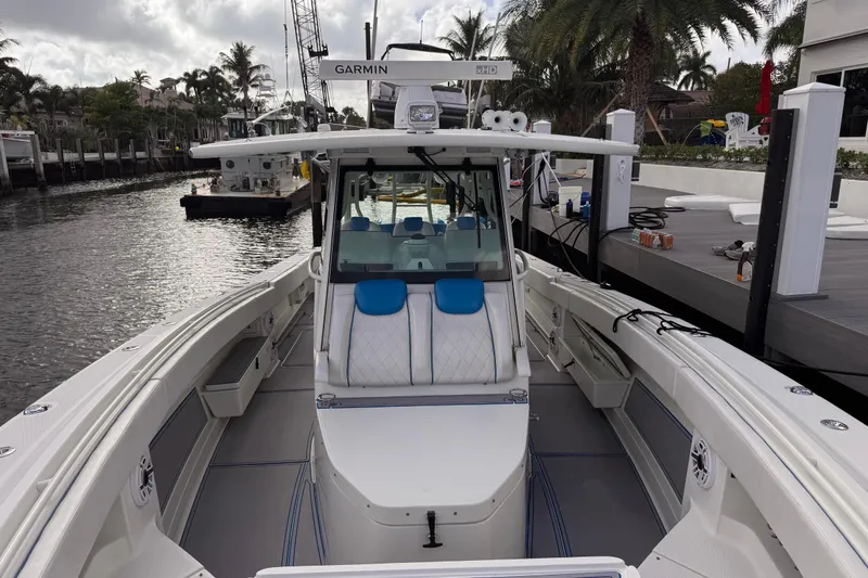 Slide: The Image of 2016 Hydra-Sports 4200 Siesta boat docked, featuring spacious seating and advanced navigation equipment. - 20