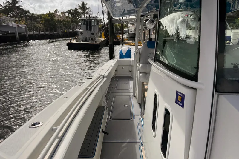 Slide: The Image of 2016 Hydra-Sports 4200 Siesta boat docked on a sunny waterfront. - 26