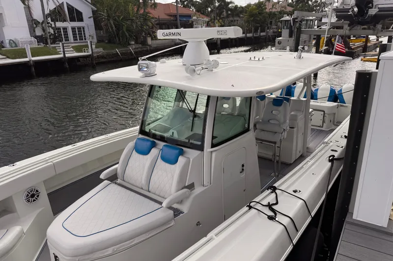 Slide: The Image of 2016 Hydra-Sports 4200 Siesta boat docked, featuring sleek design and comfortable seating. - 4